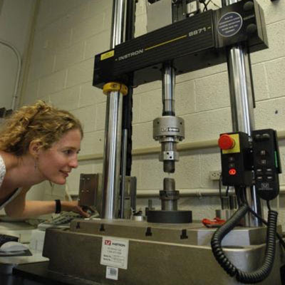 Image of woman in a lab research station