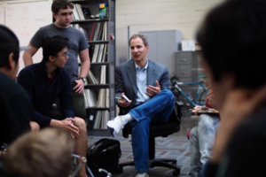 photo of Mike Cohen talking with students